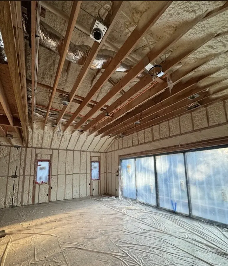 Interior walls and ceiling insulated with spray foam during new construction in Bay Harbor Islands